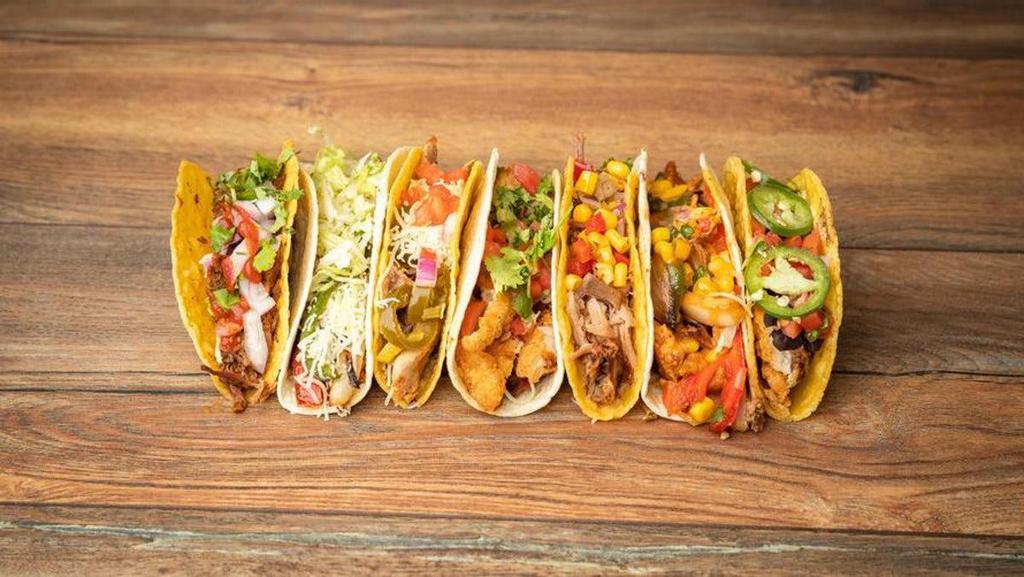 Taco Trio · Three (3) soft or hard shells stuffed with protein then filled to to the top with ingredients of your choice. Served with a small side of chips & salsa.