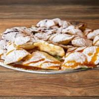 Love Chips · Flour tortillas dusted with powdered sugar and drizzled with raspberry or caramel sauce. We ...