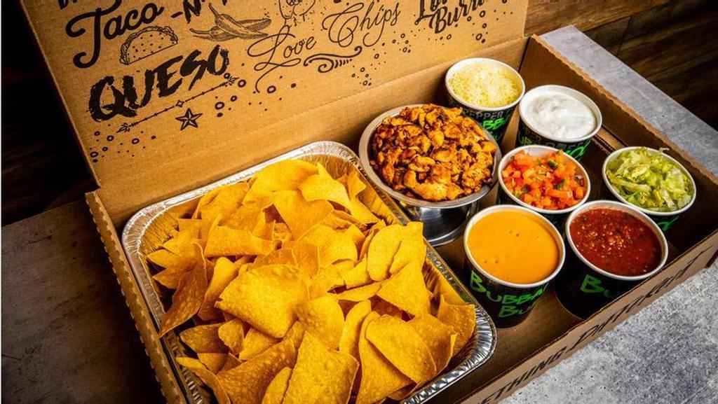 Family Nacho Kit · 1/2 tray of fresh homemade tortilla chips, 1.5lbs of your choice of protein, 1 pint of nacho cheese, 1 pint of pico de gallo, 1 pint of house salsa, 1 pint of hot salsa, 1 pint sour cream, 1 pint shredded cheese, .5lb of shredded lettuce (serves 6 people)
