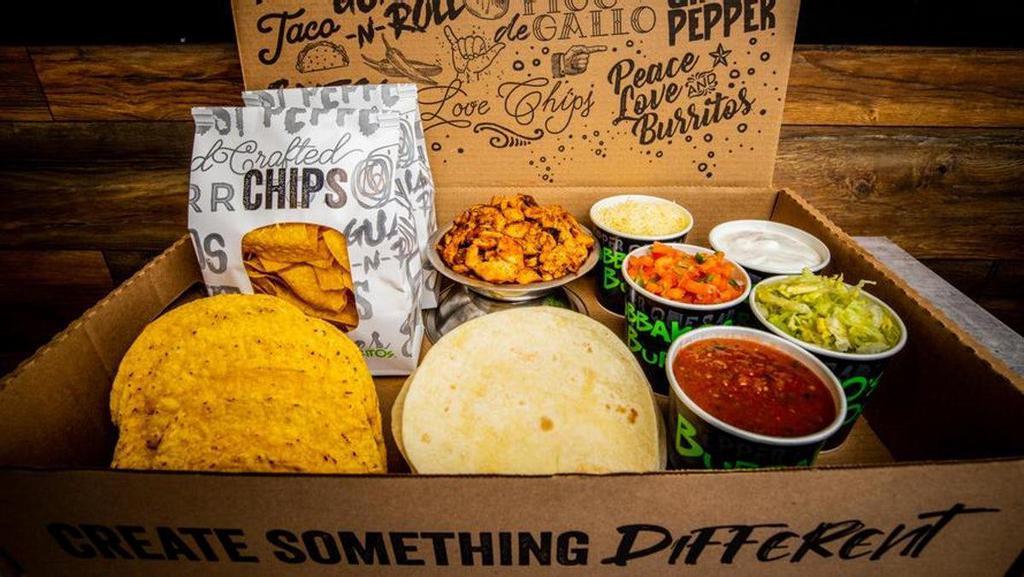 Family Taco Kit · 2 bags of homemade fresh tortilla chips, 1.5lbs of your choice of protein, 24 soft tacos (1pk), 1 pint of pico de gallo, 1 pint of house salsa, 1 pint of hot salsa, 1 pint sour cream, 1 pint shredded cheese, 1.5lb of shredded lettuce (serves 6 people)