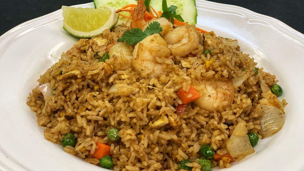 Thai Fried Rice · Curry flavored rice with shrimp, pineapple, eggs, cashews, onion and bell pepper.