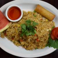 Crab Fried Rice · Thai fried rice with egg, crab meat, vegetables, onions, garlic and thai herbs.