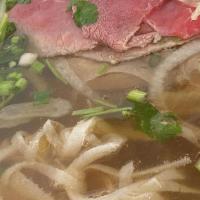 Special Combination Pho · Rare steak slices, brisket, flank, tendon & tripe in beef bone broth with rice noodles.