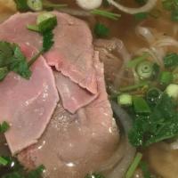 Vietnamese Spicy Beef Noodle Soup (Bún Bò Huế) · Spicy, aromatic Central Vietnam style beef noodle soup with brisket and chicken ham slices o...