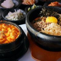 Sundubu Jjigae And Stone Pot Bibimbap · Soft Tofu Soup, choice of (Vegetable, Seafood, Beef, Mixed) with Stone Pot Bibimbap.