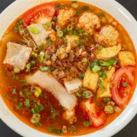Bún Riêu Đặc Biệt · Thin vermicelli noodles in crab and tomato-based soup with fried tofu, special pork & shrimp...