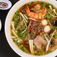 Bánh Canh Đặc Biệt · Udon noodles soup with pork slices, shrimps, fish cake slices, and quail eggs.