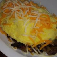 The Philly Cheese Omelet · Beef slices grilled together with roasted bell pepper and onions stuffed and topped with jac...