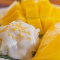 Spt'S Baked Mango Rice · Baked sticky rice sweetened with coconut milk and fresh mango.