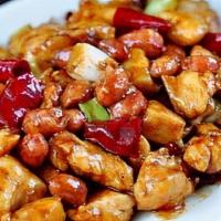 Chicken With Mama Spicy Sauce / 老干媽炒雞丁 · Diced chicken stir fried with green peppers, onions, and mama spicy sauce.