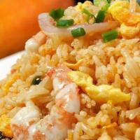 House Fried Rice / 招牌炒飯 · Rice stir fried with chicken, beef, shrimp, eggs, and green peas.