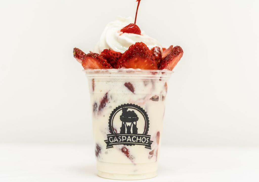 Strawberries & Cream · A full cup of strawberries mixed with our delicious cream, topped with whip cream and granola.