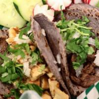 Asada Tacos · Made with handmade blue corn tortillas with meat cilantro, onion, green (mild) or red (spicy...