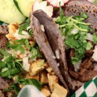 Pastor Tacos · Made with handmade blue corn tortillas with meat cilantro, onion, green (mild) or red (spicy...