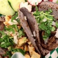 Grilled Chicken Tacos · Made with handmade blue corn tortillas with meat cilantro, onion, green (mild) or red (spicy...