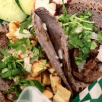 Chorizo Tacos · Made with handmade blue corn tortillas with meat cilantro, onion, green (mild) or red (spicy...
