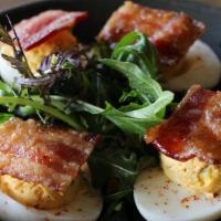 Bacon And Eggs · Deviled eggs with brown sugar-chili applewood smoked bacon and Sriracha aioli. Gluten free.