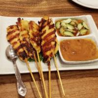 Chicken Satay · Gluten-free. Marinated all-natural chicken breast served with peanut sauce and cucumber salad.