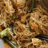 Pad Thai · Gluten-free. Skinny rice noodles with organic tofu, cage-free eggs, onions, Cosmo bean sprou...