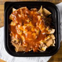 Super Nacho With Meat · Choice of asada, chicken, carnitas, al pastor or ground beef. Chips, Beans, Cheese, enchilad...