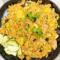 Pineapple Fried Rice · Choice of protein stir fried with rice, eggs, pineapple, onion, raisin, cashew nut, peas, ca...