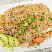 House Fried Rice · Choice of protein stir fried with rice, eggs, onion, peas, carrot, tomatoes and garnished wi...