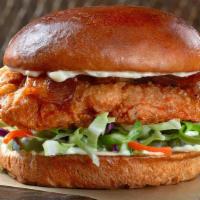The Fried Slammer · This is our most wanted culprit. Chicken breast, topped with bacon, mayo, fresh cabbage mix ...