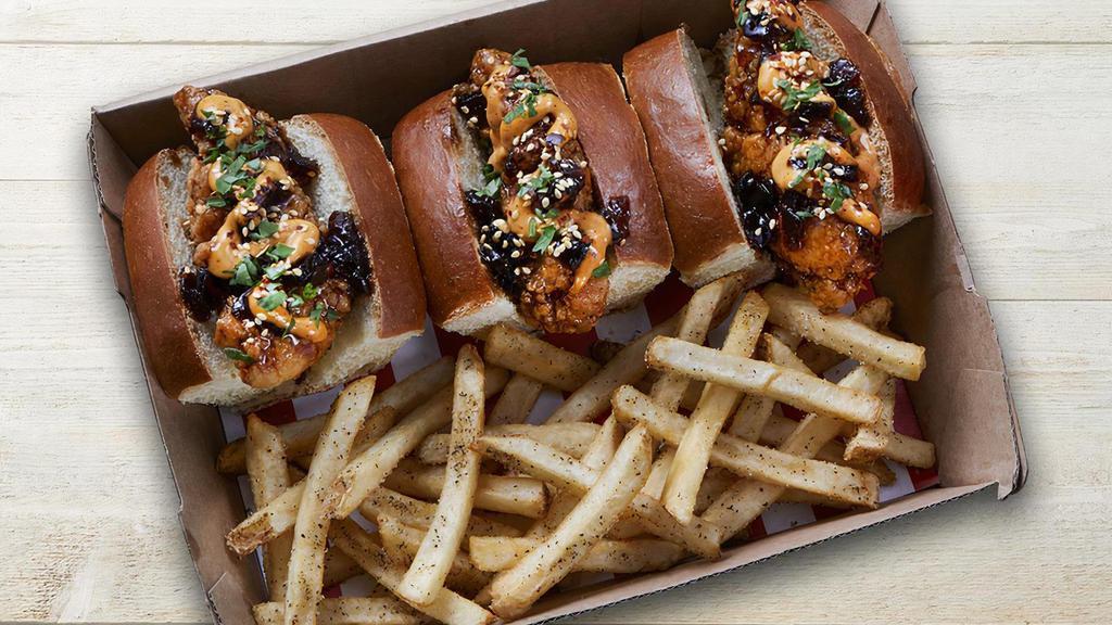 Whiskey-Glazed Bird Dogs · 3 Chicken fingers tossed in Whiskey-Glaze on mini buns with spicy aioli and sesame seasoning. Paired with seasoned fries.
