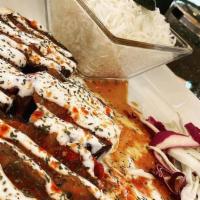 Borani Banjan · Oven roasted eggplant with tomatoes, roasted bell peppers, and garlic yogurt mint sauce, and...