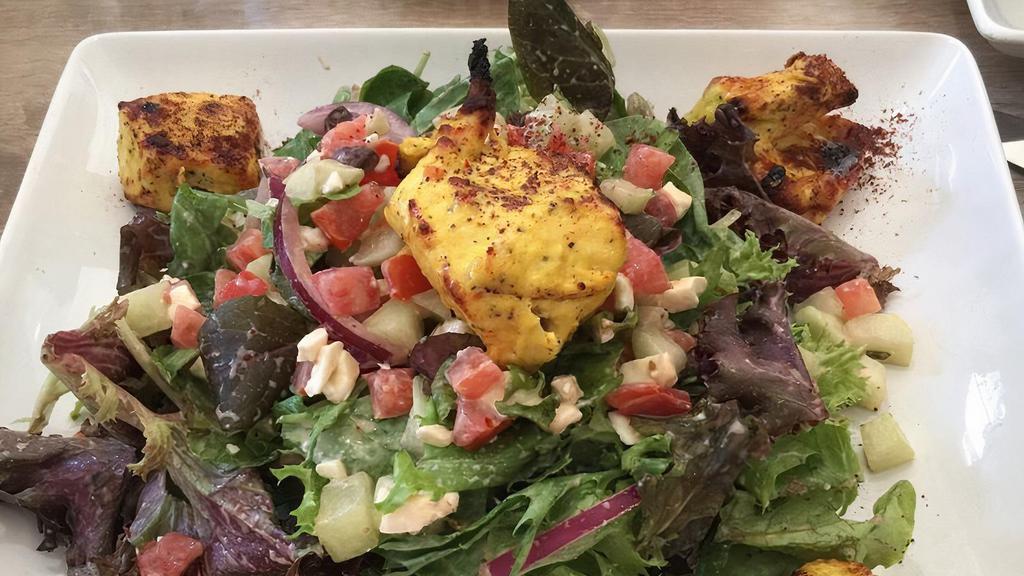 Mazaa Chicken Kabob Salad · Mixed baby greens, with cucumbers, red onions, tomatoes, Feta cheese, balsamic vinaigrette dressing, and marinated chicken breast.
