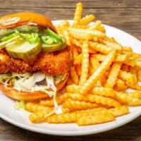 Hot Fish Sandwich And Waffle Fries · Crispy wild pacific cod, shaved cabbage, serano chile, pickles, tartar sauce, diablo sauce.