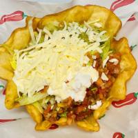 Taco Salad · Flour tortilla bowel filled with your choice of meat, rice, refried beans topped with lettuc...