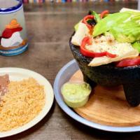 Molcajete Beef Or Chicken Or Mix · Your choice of meat served with rice, beans, guacamole, sour cream and our delicious molcaje...