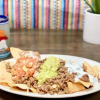 Super Nacho · A plate of chips topped with your choice of meat, cheese, beans, guacamole, salsa and sour c...