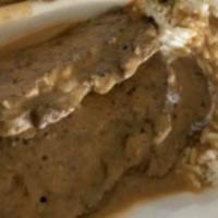 Meatloaf · Served with rice, gravy and 2 sides.