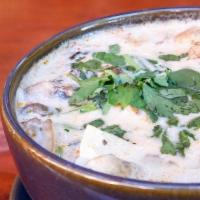 Tom Kha · Coconut milk broth, mushrooms, galangal, lemongrass, cilantro, kaffir lime.