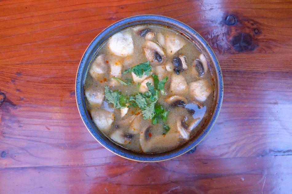 Tom Yum · Clear sour-spicy broth, mushrooms, galangal, lemongrass, cilantro, kaffir lime.