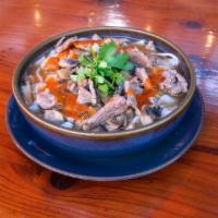 Thai Noodle Soup · Wide rice noodles, bean sprouts, mushrooms, cilantro, sriracha sauce, hearty spicy broth.