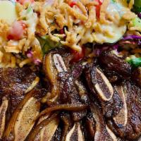 Beef Short Ribs With Rice And Salad · Popular item.