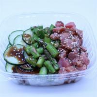 Poke Bowl · Rice, ahi tuna, hi poke sauce, cucumber salad, masago, ginger, sesame seed, and green onion.