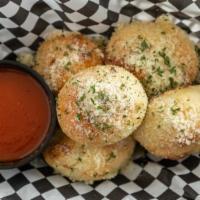 Garlic Knots (Five) · Served with a side of marinara.
