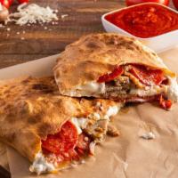 Meat Lovers Calzone · Pepperoni, sausage, ham, Salami and meatballs. Served with marinara sauce.