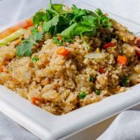 Fried Rice · Comes with choice of meat.  Stir-fried rice with egg peas and carrots,  onion and served wit...