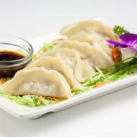 Steamed Dumplings · Dumplings filled with ground chicken, cabbage and scallion served with sweet soy sauce. (6pc...