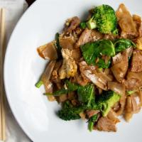 Pad See Ew · Stir fried flat rice noodle with dark soy sauce, Chinese broccoli, broccoli garlic and egg.