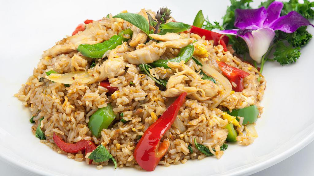 Spicy Fried Rice · Steamed rice with chili, egg, red and green bell pepper, onion, garlic, and basil leaves. Curry.