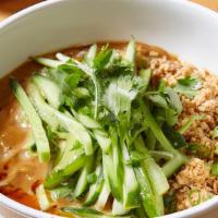 Dan Dan Noodles · Sesame-peanut sauce, chili oil, cucumbers, and crushed peanuts. Served with thin wheat-based...