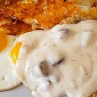 Country Fried Steak And Eggs · Our famous country fried steak topped with sausage gravy and served with two eggs any style ...