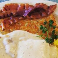 Combo Breakfast · Our homemade biscuit topped with our delicious sausage gravy, served with two eggs* any styl...