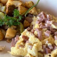 Diced Ham And Scrambled Eggs · Two scrambled eggs and diced ham, served with choice of 